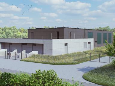 Technisches Betriebsgebäude in parkähnlicher Landschaft mit Bäumen im Hintergrund